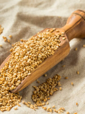 Organic toasted sesame seeds in a scoop