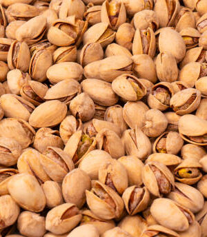 Tasty pistachios isolated on a white background.