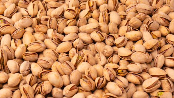 Tasty pistachios isolated on a white background.