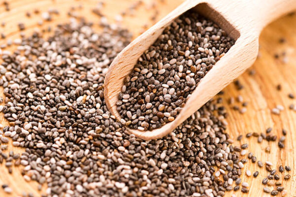 Nutritious chia seeds on a wooden spoon
